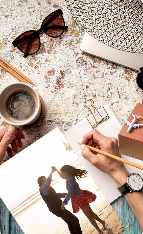 Travel flatlay with map, coffee and photographs